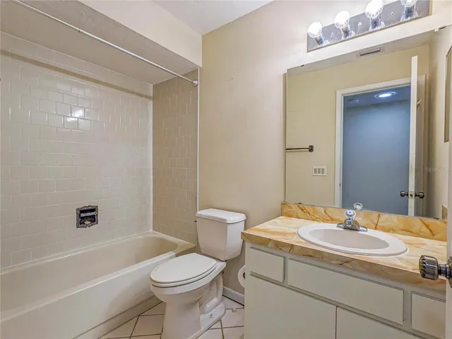 a bathroom with a sink a toilet and a bathtub