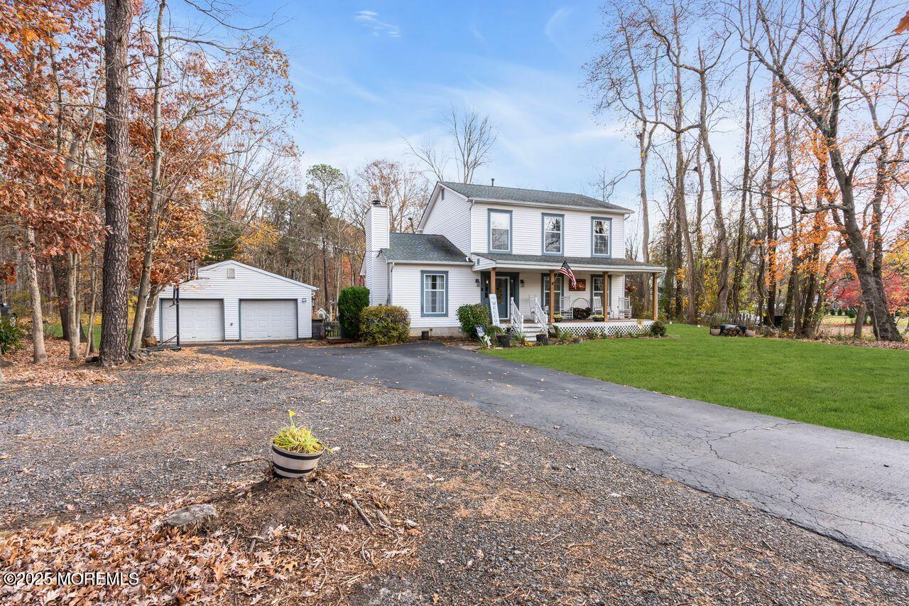 1300 Maxim Southard Road Howell, NJ 07731 - Photo 11 of 61 a front view of a house with a yard and tree s