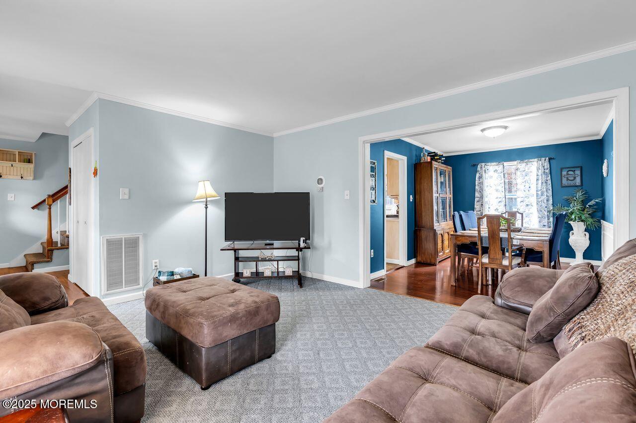 1300 Maxim Southard Road Howell, NJ 07731 - Photo 19 of 61 a living room with furniture and a flat screen tv