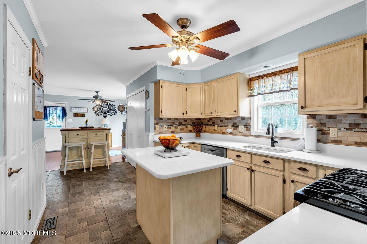 1300 Maxim Southard Road Howell, NJ 07731 - Photo 22 of 61 a kitchen with a sink stove and cabinets