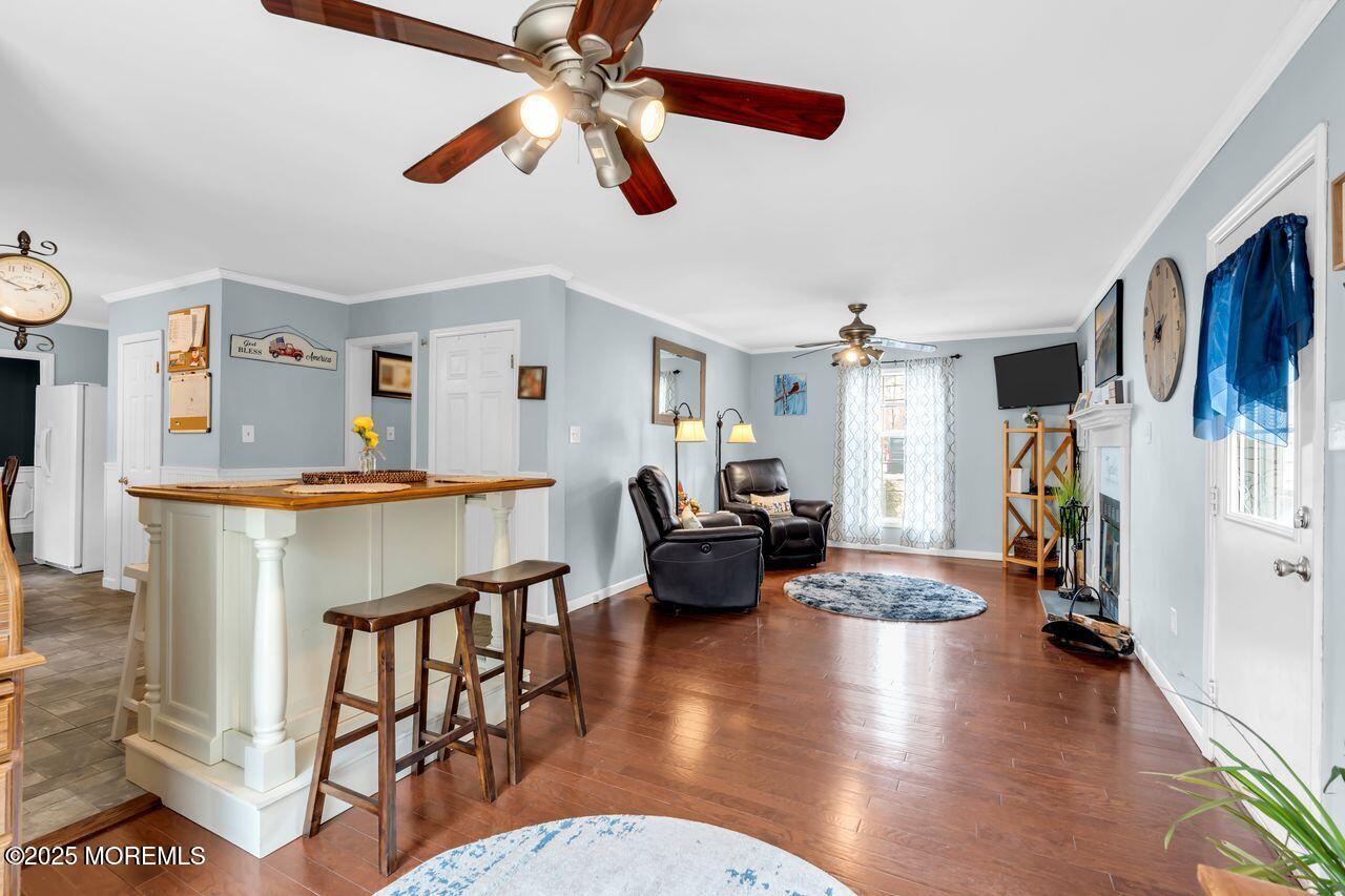 1300 Maxim Southard Road Howell, NJ 07731 - Photo 25 of 61 a living room with furniture and a chandelier