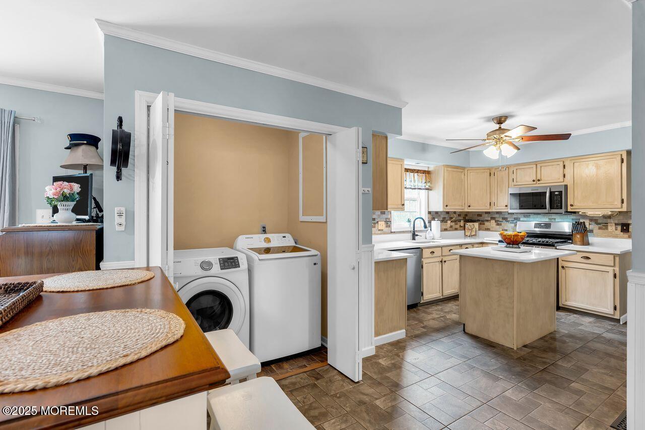 1300 Maxim Southard Road Howell, NJ 07731 - Photo 26 of 61 a kitchen with a sink a stove and refrigerator