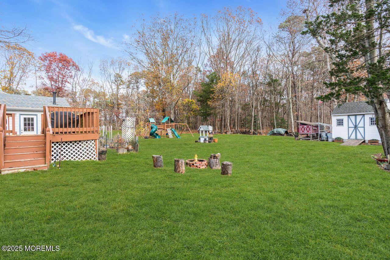 1300 Maxim Southard Road Howell, NJ 07731 - Photo 40 of 61 a front view of a house with garden and trees