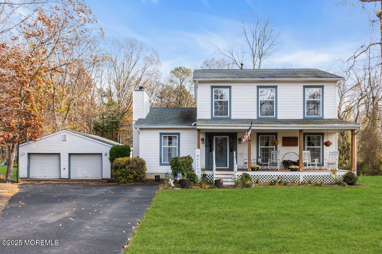 1300 Maxim Southard Road Howell, NJ 07731 - Photo 8 of 61 a front view of a house with a yard patio and a fire pit