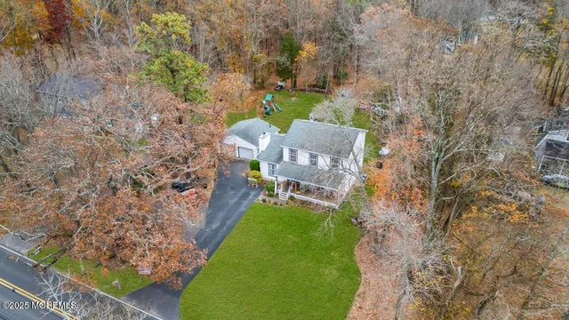 a view of a patio with a table chairs and a flower garden