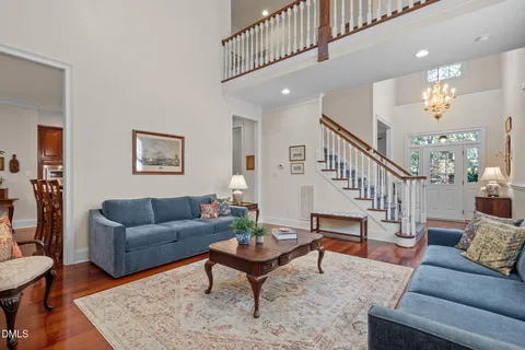 a living room with furniture and a rug