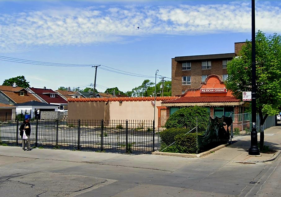 2430 North Central Avenue Chicago, IL 60639 - Photo 3 of 5 a front view of a house with a porch