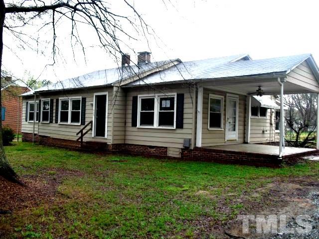 2509 Ross Road Durham, NC 27703 - Photo 1 of 24 a view of an house with backyard space and garden