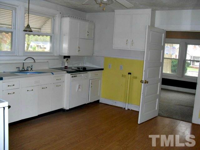 2509 Ross Road Durham, NC 27703 - Photo 15 of 24 a kitchen with cabinets and window