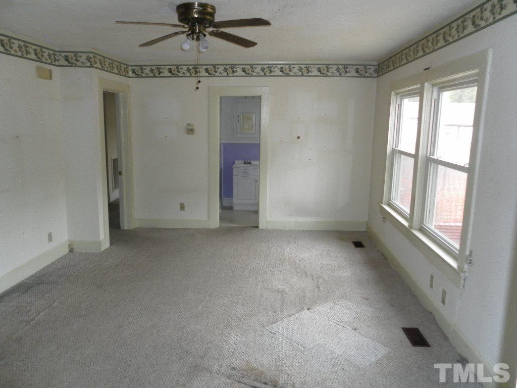2509 Ross Road Durham, NC 27703 - Photo 21 of 24 a view of an empty room with a window
