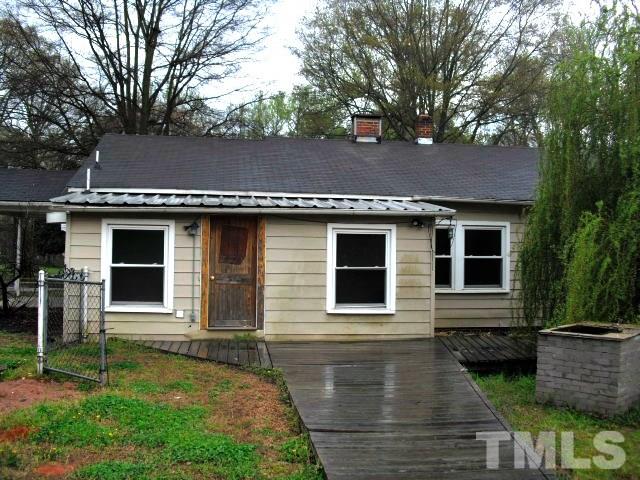 2509 Ross Road Durham, NC 27703 - Photo 3 of 24 a front view of a house with garden