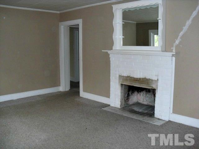 2509 Ross Road Durham, NC 27703 - Photo 5 of 24 a view of a livingroom with a fireplace
