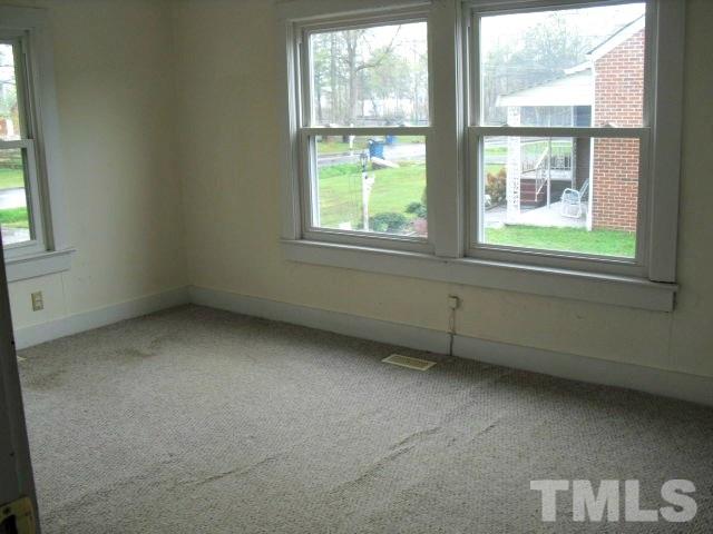 2509 Ross Road Durham, NC 27703 - Photo 7 of 24 a view of an empty room with a window