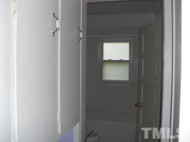 2509 Ross Road Durham, NC 27703 - Photo 9 of 24 a bathroom with a bathtub