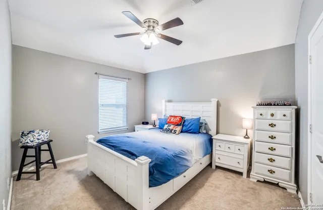 a bedroom with a bed and a cabinets