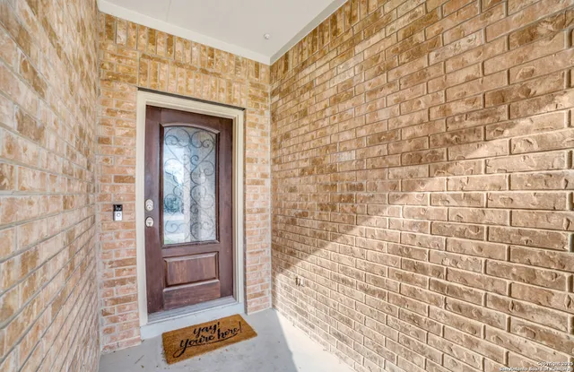 a bathroom with a shower and a sink
