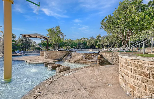 a view of a swimming pool with an outdoor space and seating area