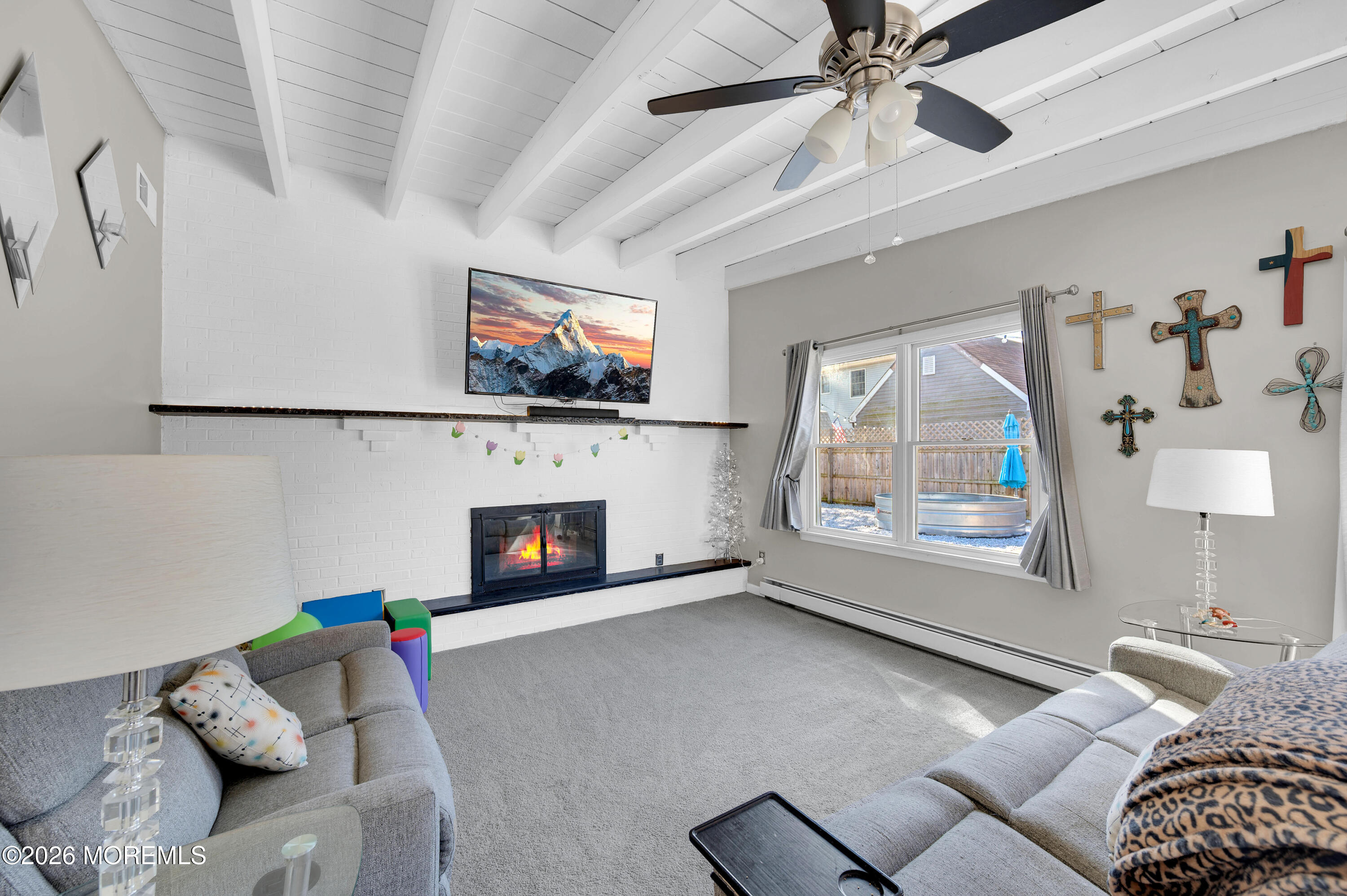 715 Tampa Road Forked River, NJ 08731 - Photo 18 of 44 a living room with furniture and a fireplace