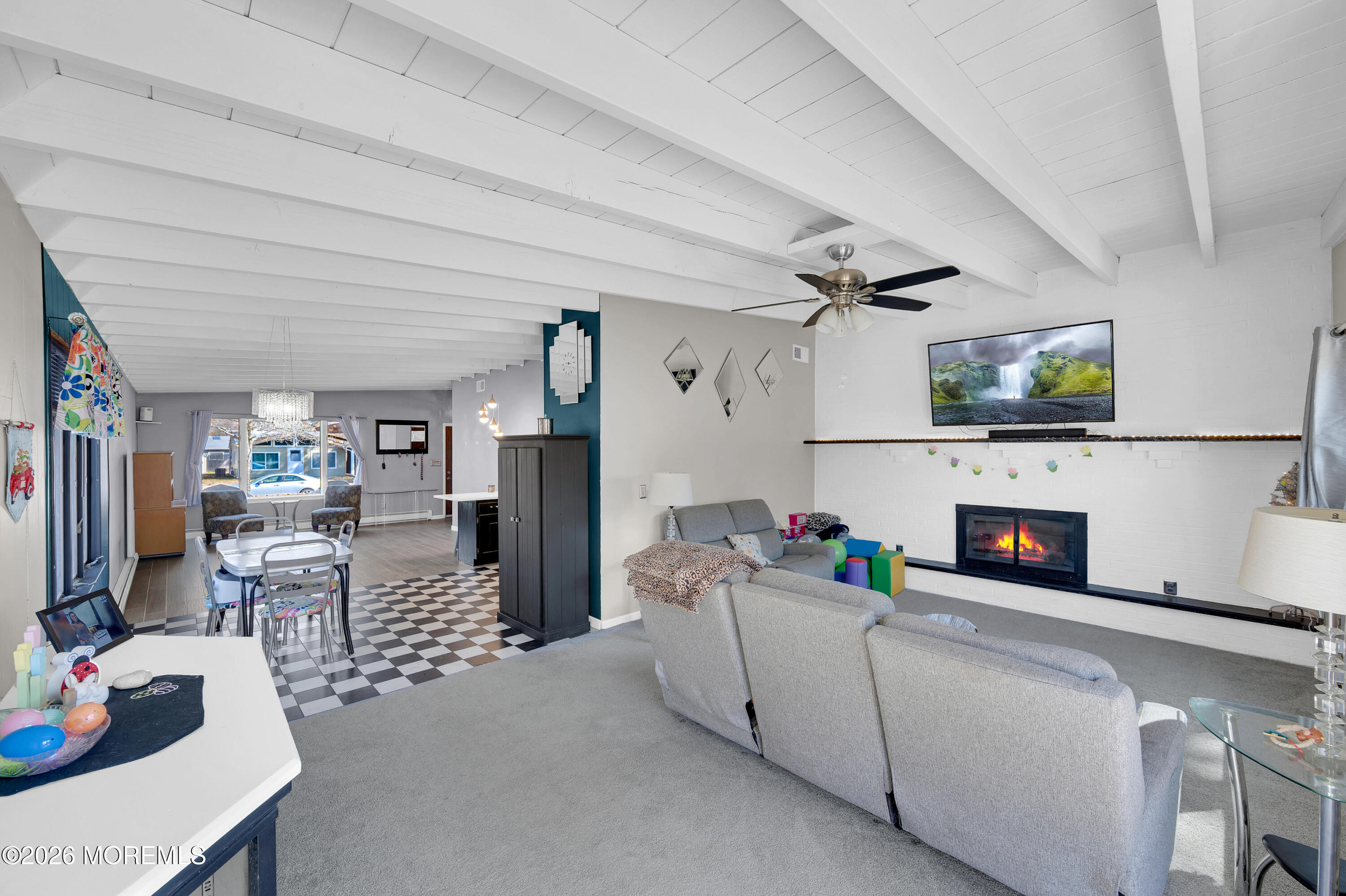 715 Tampa Road Forked River, NJ 08731 - Photo 20 of 44 a living room with furniture and a fireplace