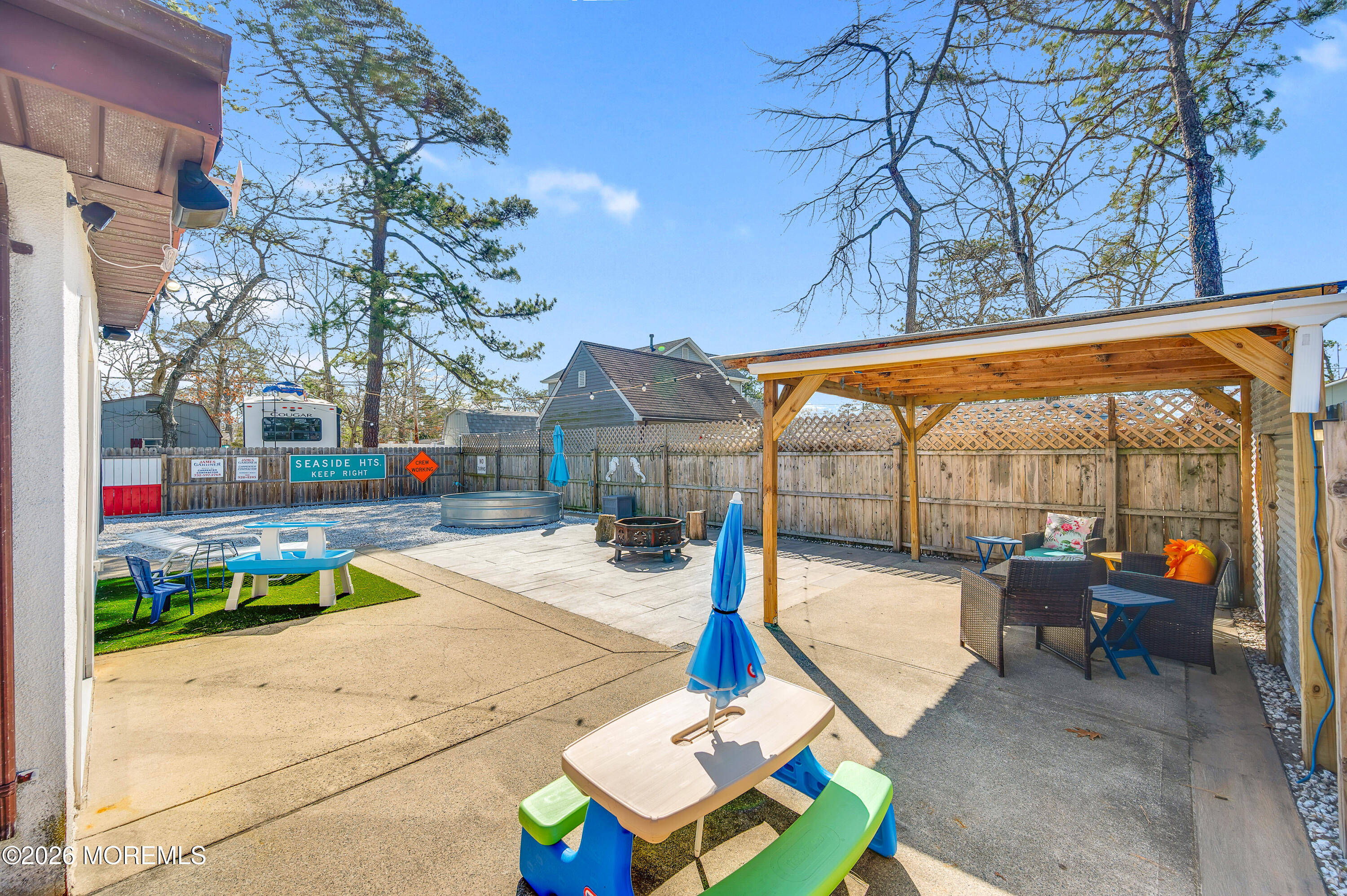715 Tampa Road Forked River, NJ 08731 - Photo 32 of 44 a view of a patio with a table and chairs