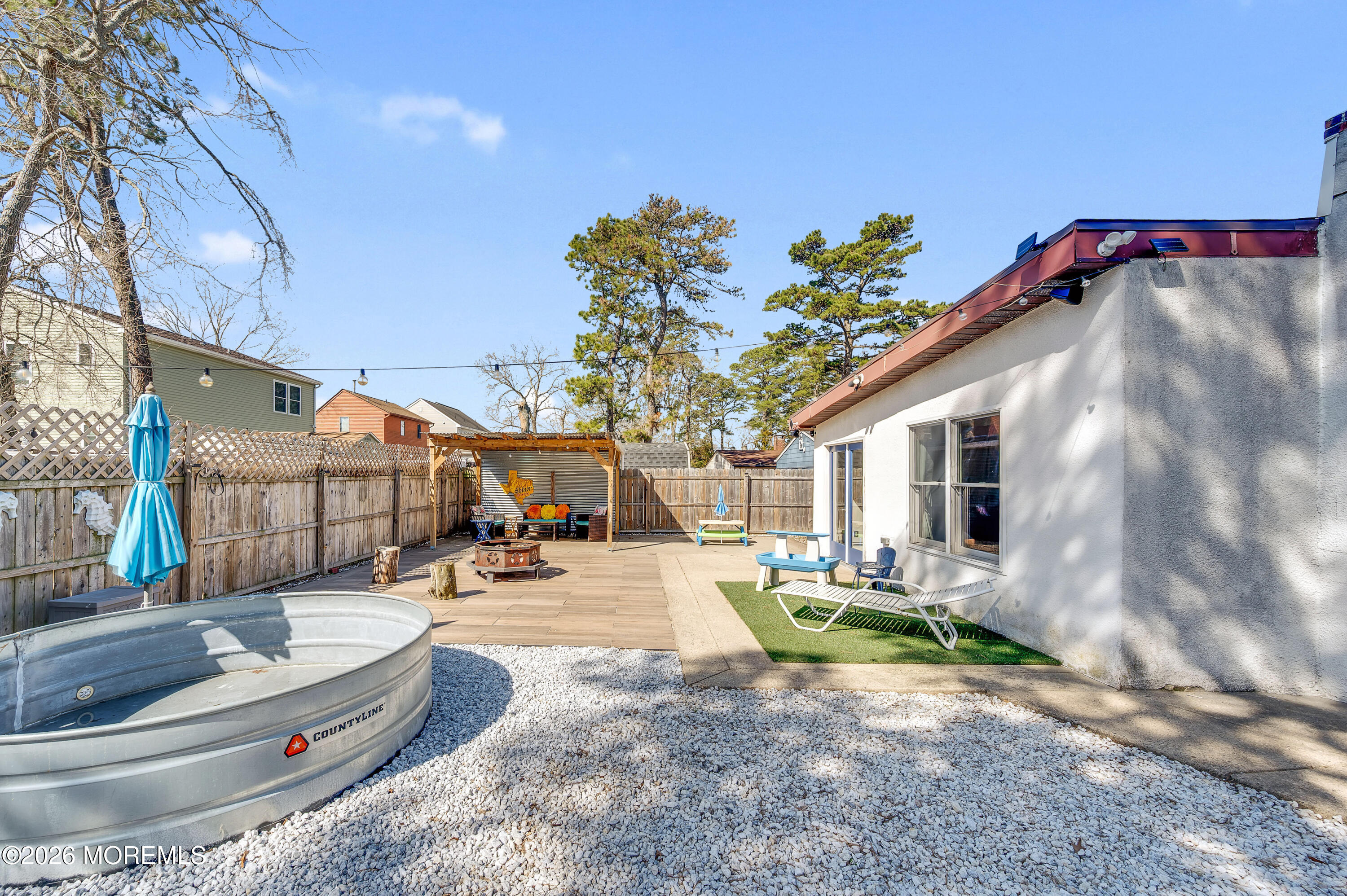 715 Tampa Road Forked River, NJ 08731 - Photo 39 of 44 a backyard of a house with yard and outdoor seating
