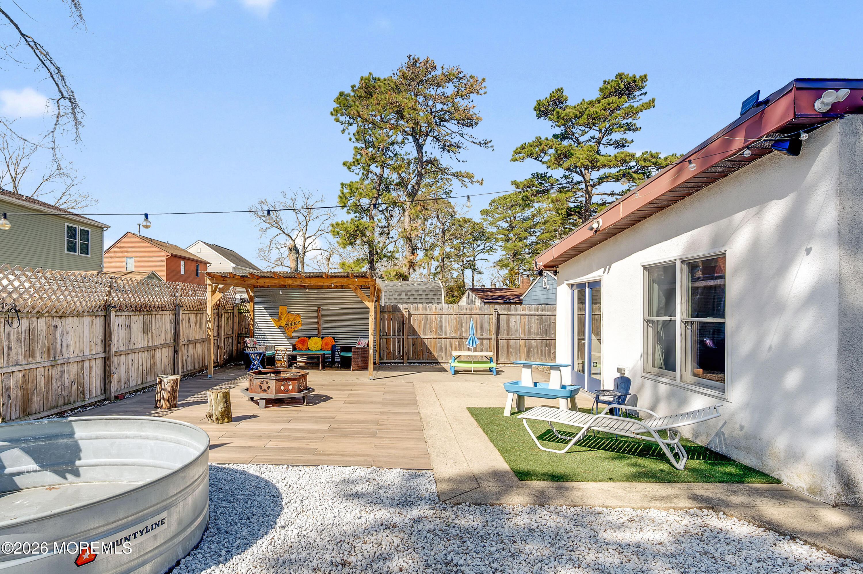 715 Tampa Road Forked River, NJ 08731 - Photo 40 of 44 a view of a house with backyard sitting area and swimming pool