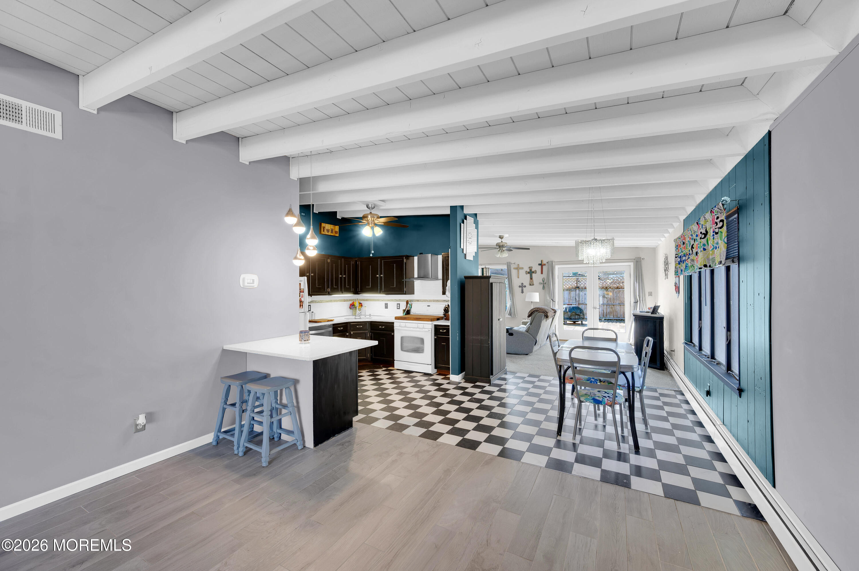 715 Tampa Road Forked River, NJ 08731 - Photo 8 of 44 a dining room with furniture and a rug