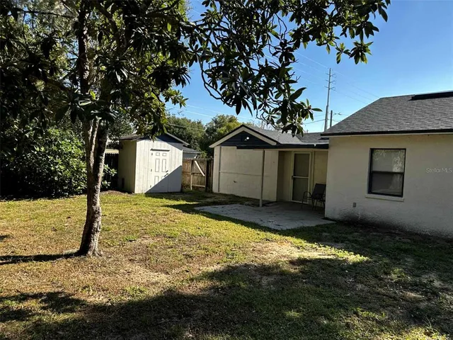 a house view with a backyard space