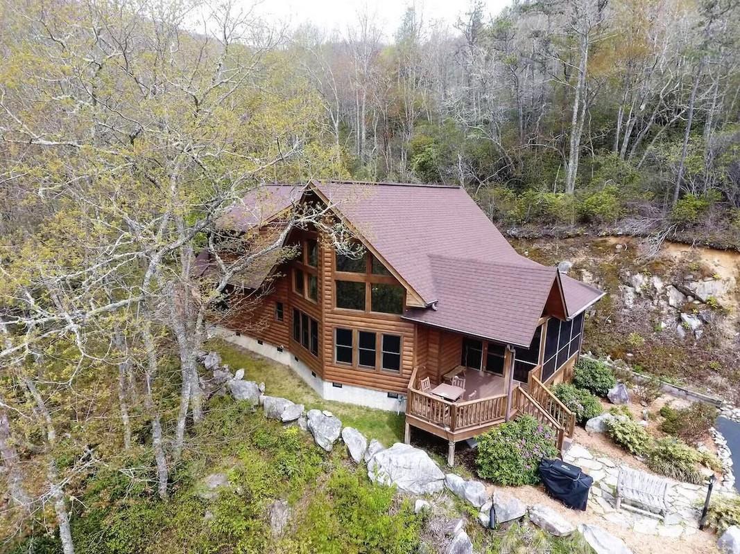 a aerial view of a house with a yard