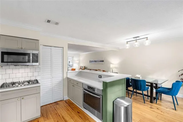 a kitchen with a stove and a microwave