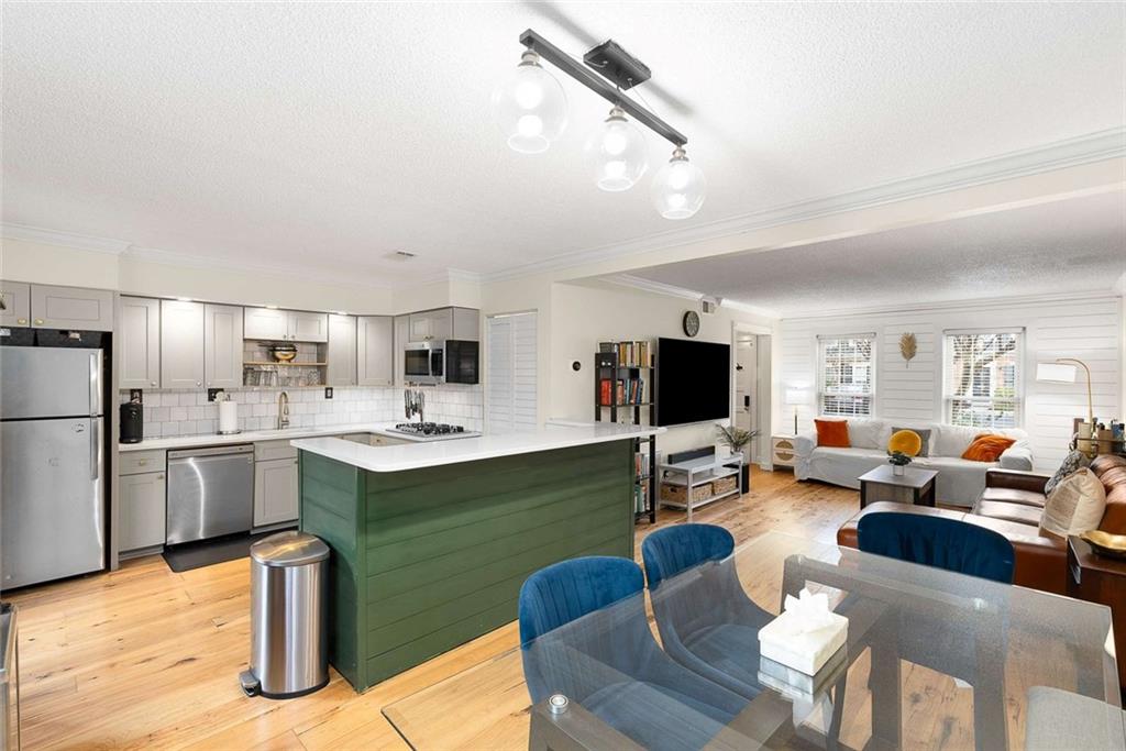 5 Spinning House Place Northwest Atlanta, GA 30318 - Photo 15 of 42 a living room with fireplace furniture and a flat screen tv