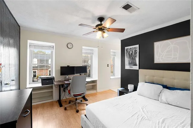 a bedroom with a workspace