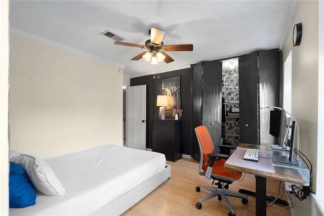 a bedroom with furniture and a window