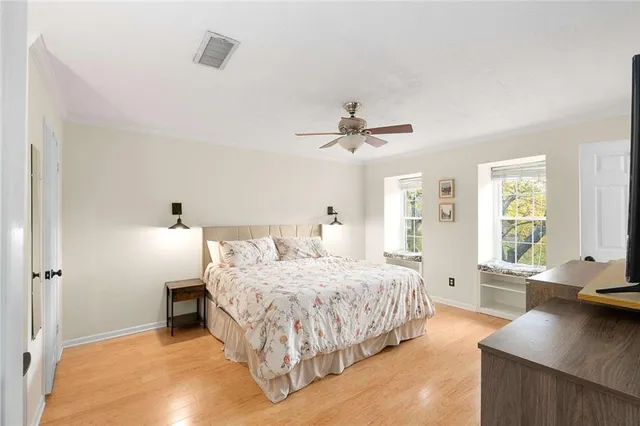 a bedroom with a bed and a table in it