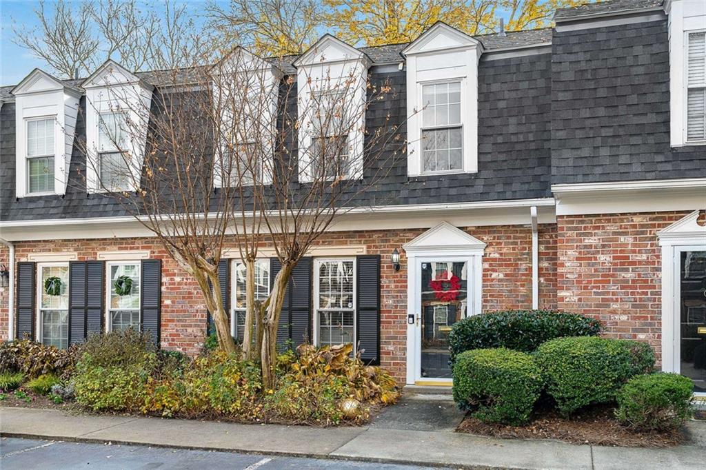 5 Spinning House Place Northwest Atlanta, GA 30318 - Photo 2 of 42 a front view of a building with garden