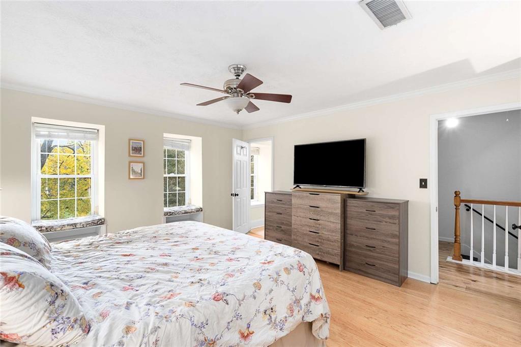 5 Spinning House Place Northwest Atlanta, GA 30318 - Photo 21 of 42 a bedroom with a bed and a flat screen tv