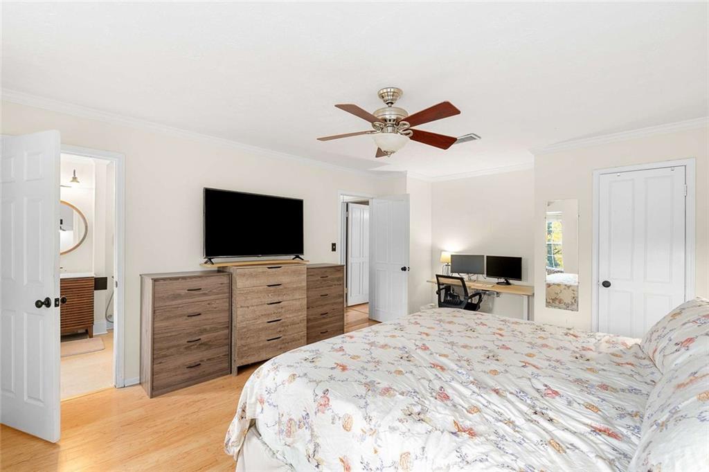 5 Spinning House Place Northwest Atlanta, GA 30318 - Photo 22 of 42 a bed room with a television and a mirror