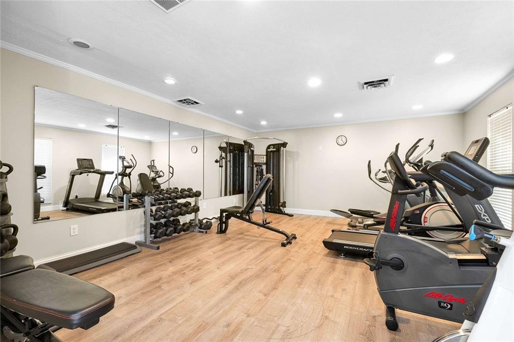 5 Spinning House Place Northwest Atlanta, GA 30318 - Photo 24 of 42 a view of a room with gym equipment
