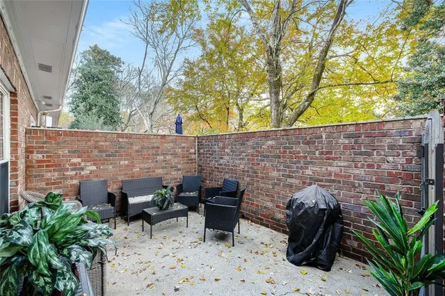 a backyard of a house with couple of trees