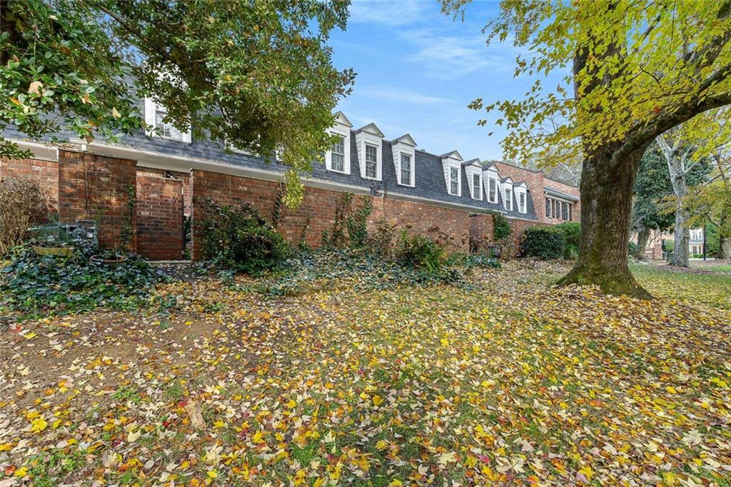 5 Spinning House Place Northwest Atlanta, GA 30318 - Photo 30 of 42 a view of a yard with plants and large trees