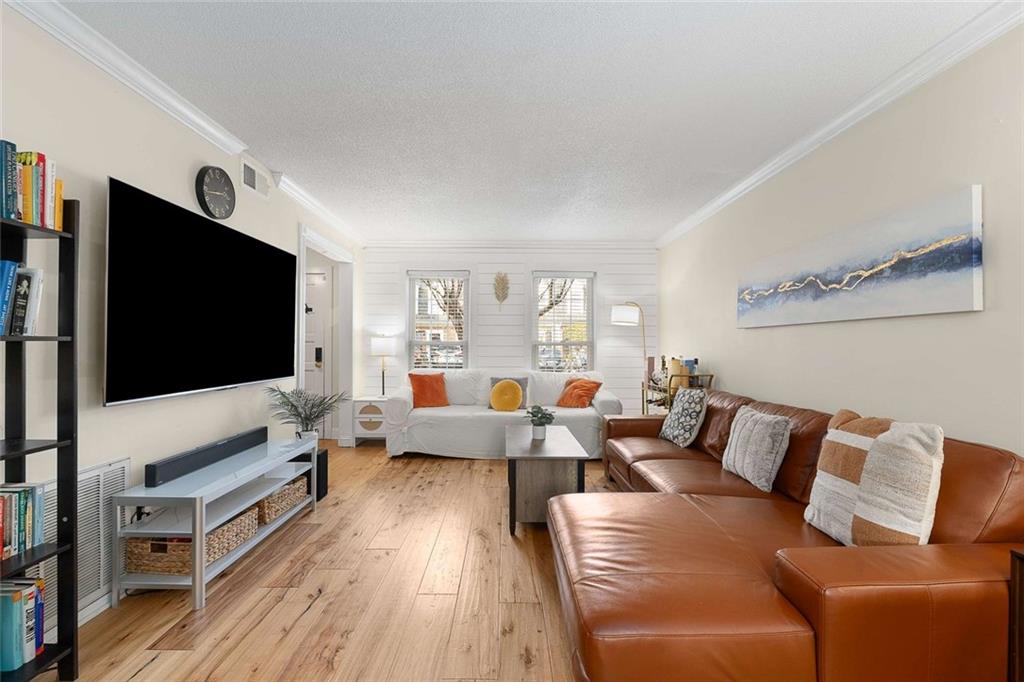 5 Spinning House Place Northwest Atlanta, GA 30318 - Photo 6 of 42 a living room with furniture and a flat screen tv