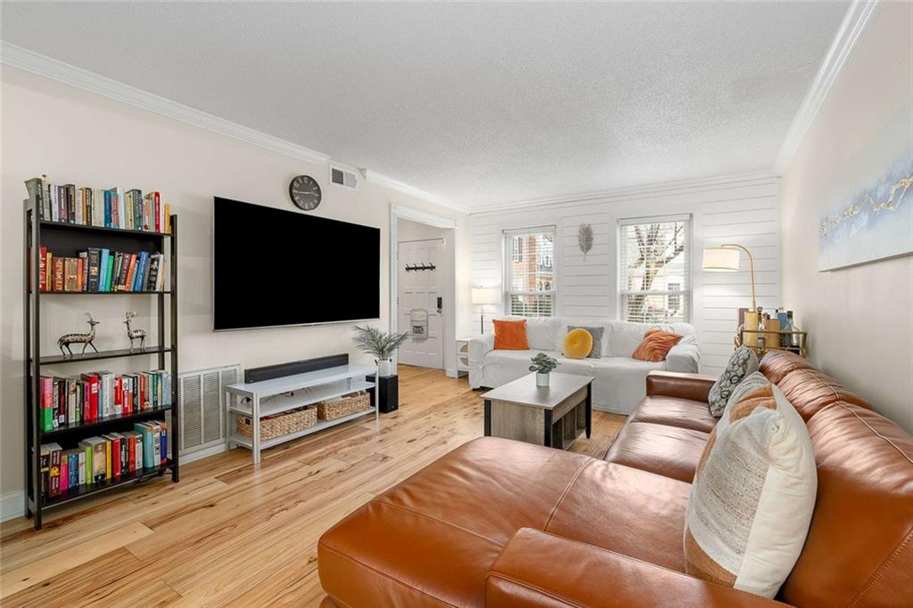 5 Spinning House Place Northwest Atlanta, GA 30318 - Photo 7 of 42 a living room with furniture and a flat screen tv