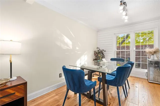 a view of a dining room with furniture window and wooden floor