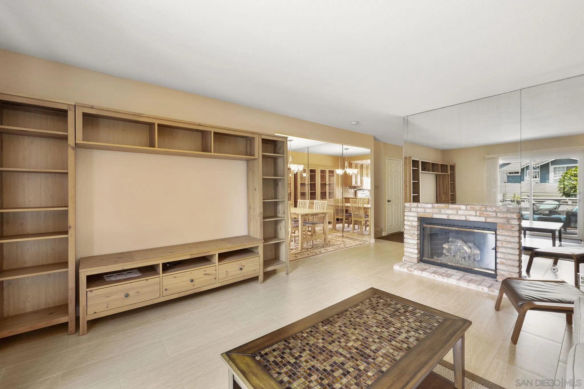 677 Summer View Circle Encinitas, CA 92024 - Photo 16 of 58 a living room with furniture flat screen tv and a fireplace