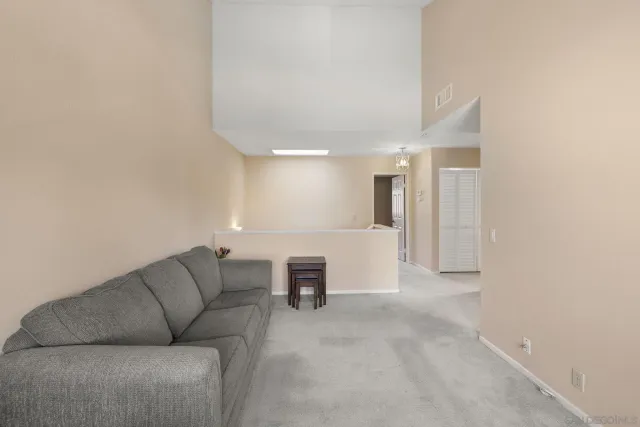 a bathroom with a granite countertop sink a mirror and a shower