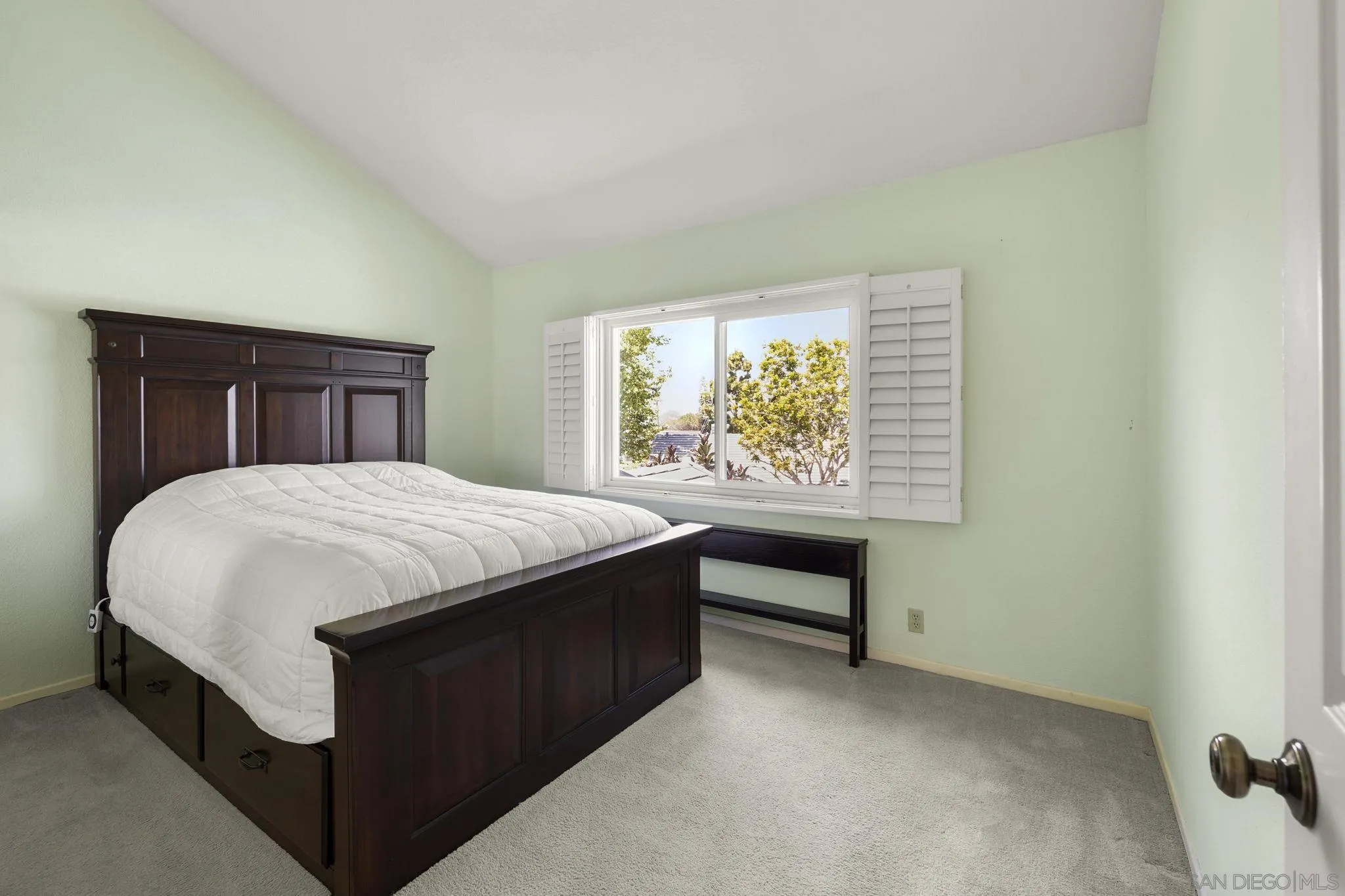 677 Summer View Circle Encinitas, CA 92024 - Photo 22 of 58 a bed sitting in a bedroom next to a window