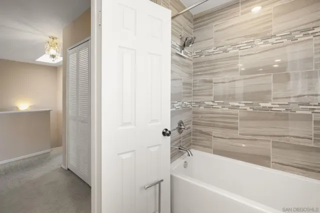 a bedroom with a bed and dresser