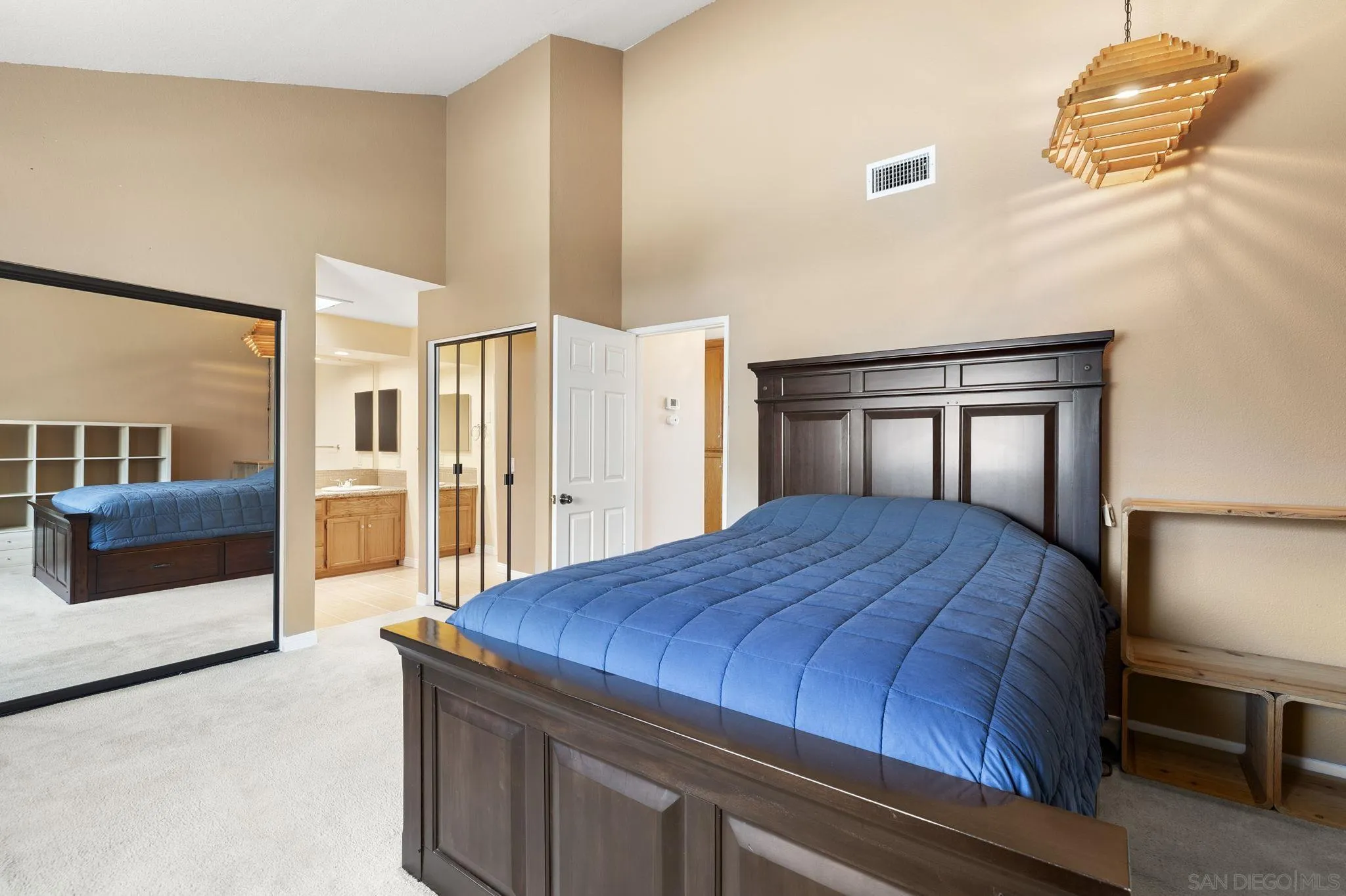 677 Summer View Circle Encinitas, CA 92024 - Photo 27 of 58 a bedroom with a bed and dresser