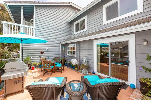 a swimming pool with outdoor seating and yard