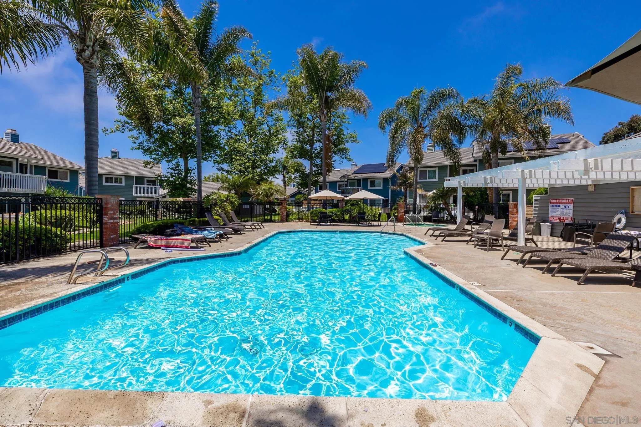 677 Summer View Circle Encinitas, CA 92024 - Photo 40 of 58 a swimming pool with outdoor seating and yard